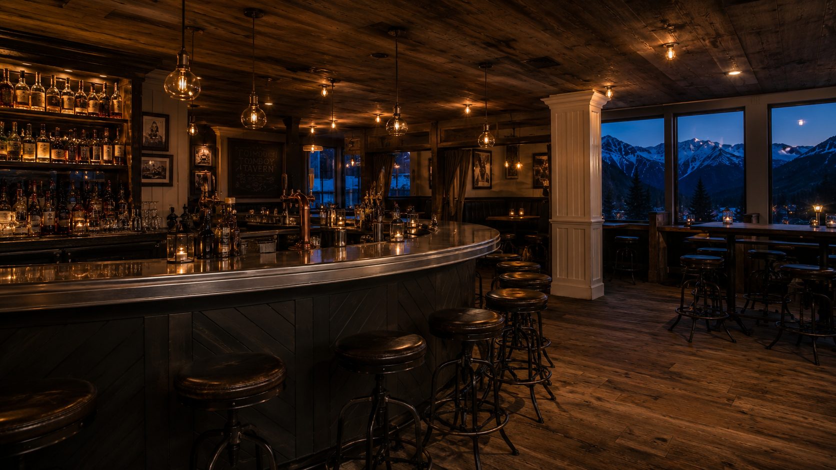 Wraparound horseshoe bar at Tomboy Tavern with mountain view
