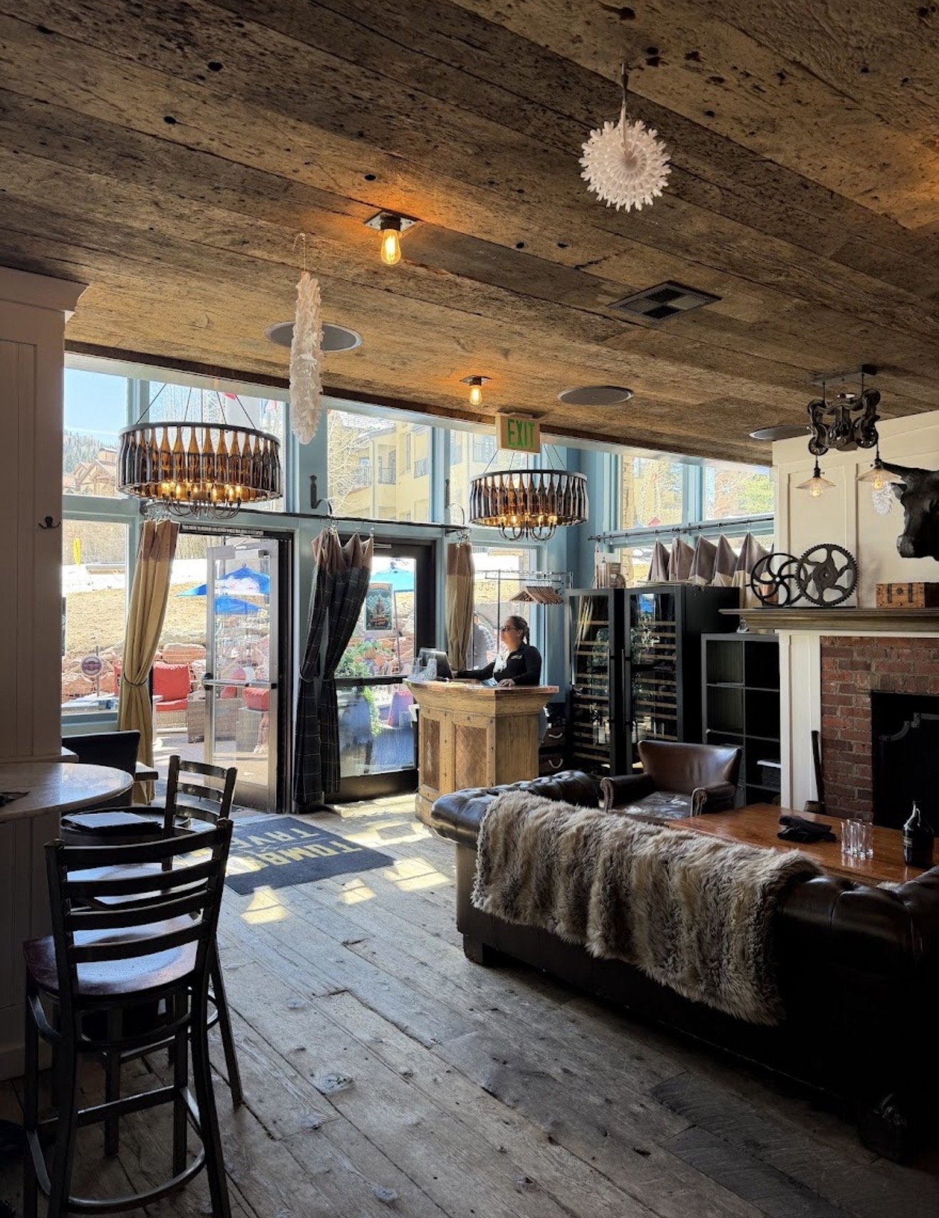 Fireplace lounge and host stand at Tomboy Tavern